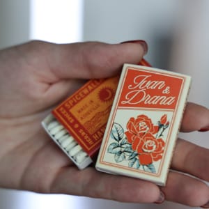 Hand holding custom matchboxes
